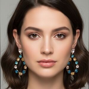 Elegant earrings with crystal stones in blue, pink and gold tones